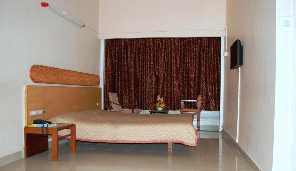 Hotel Raviraj Pune Bilik gambar